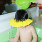 Visière chapeau pour douche bébé capte-l’attention-de-votre-tout-petit